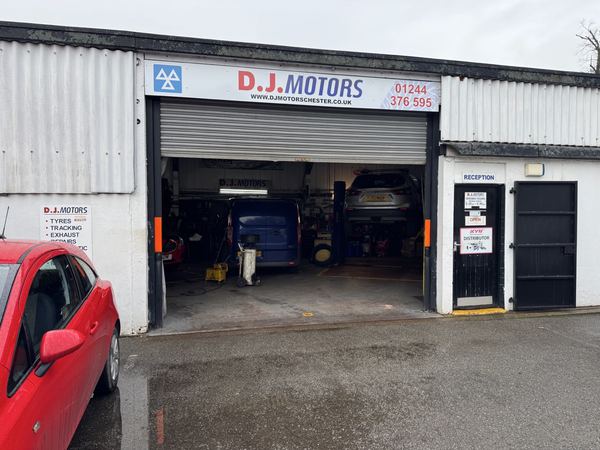 DJ Motors garage frontage showing the main entrance, signage and reception door on Parkgate Road, Chester